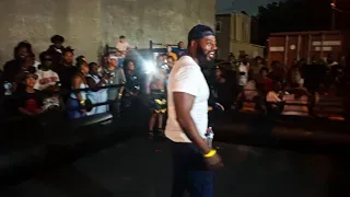 Gloves Up Guns Down live outdoor community boxing ring night and crowd